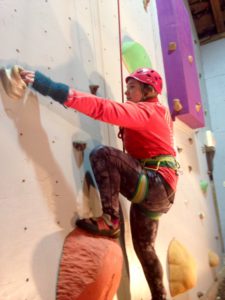 women in red climbing