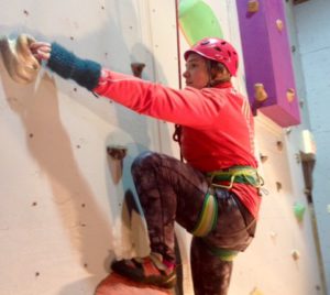women in red climbing