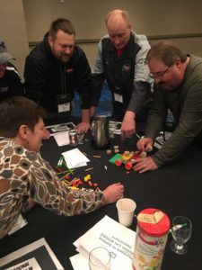 men working on tinker toys