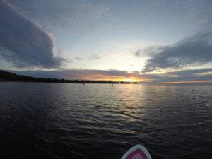 sunset paddle board