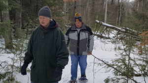 men snow shoeing