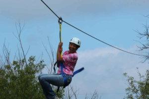 smiling face while zip lining