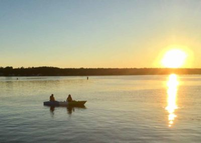 couple kayaking at sunset