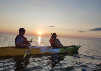 couple on a sunset kayak tour