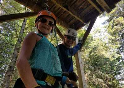 dad and daughter zip lining