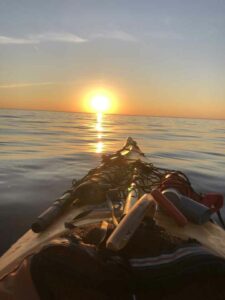 kayak looking into sunset