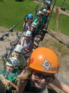 group of kids zip lining