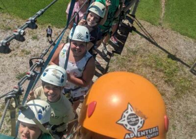 group of kids zip lining