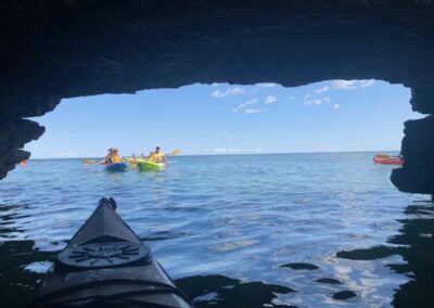 kayak looking out of cave